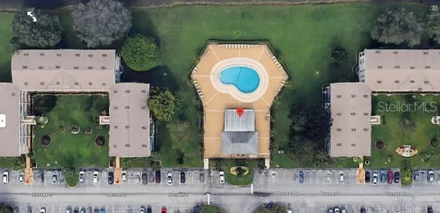 an aerial view of a house with garden space sitting space and swimming pool