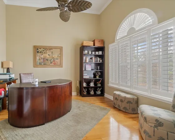 a large white kitchen with stainless steel appliances granite countertop a stove a sink and a microwave