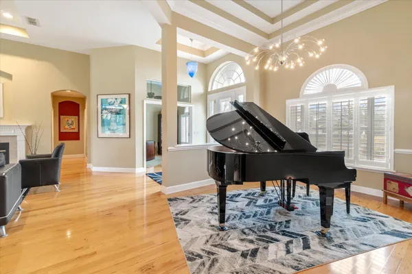 a view of a swimming pool with a lake view and sitting space