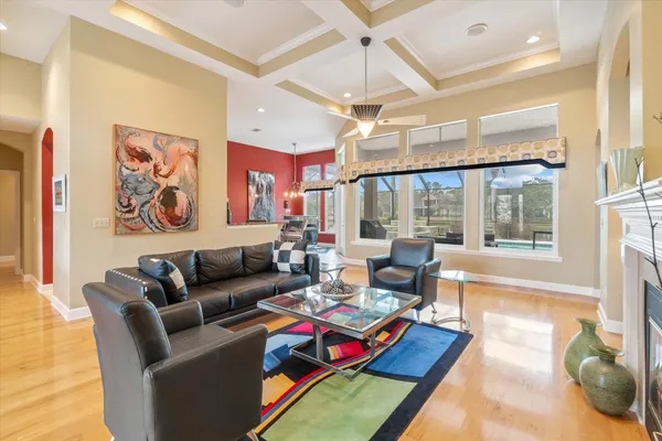 a living room with furniture windows and wooden floor