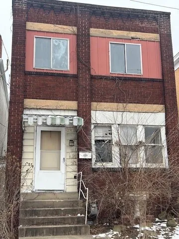 a front view of a house with a garage