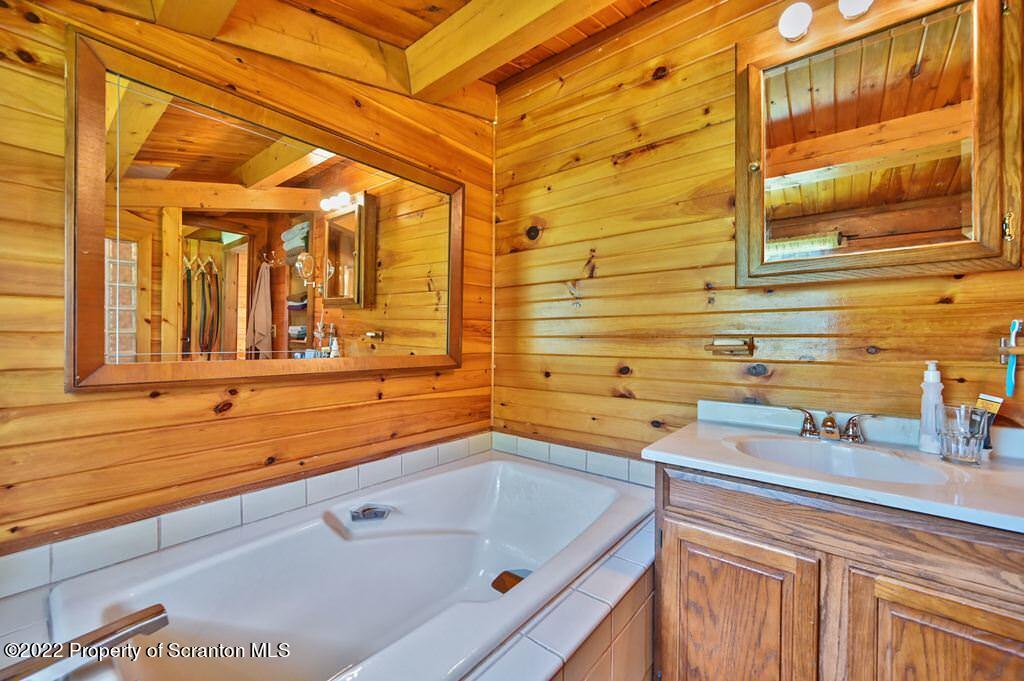 745 Woodbourne Road Montrose, PA 18801 - Photo 54 of 120 a bathroom with a sink and a bathtub