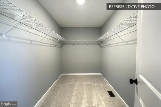 a view of a room with racks on the wall