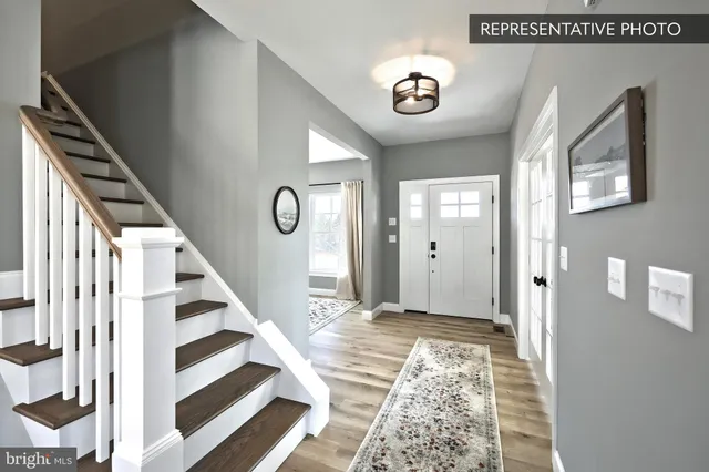 a view of an entryway with wooden floor