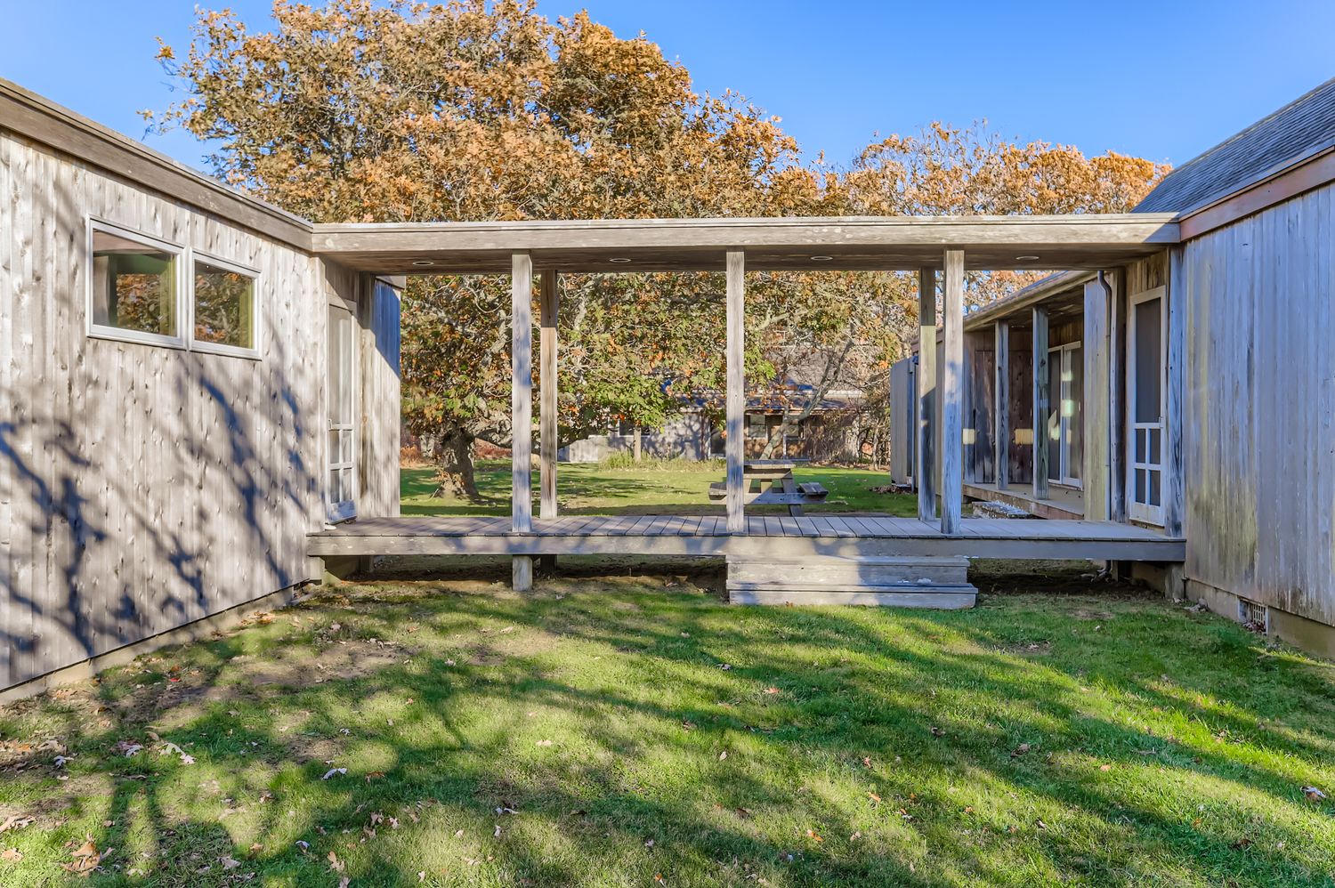 7 Black Point Road Chilmark, MA 02535 - Photo 13 of 47 a view of a house with backyard and porch