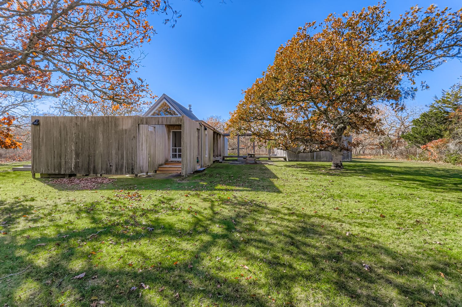 7 Black Point Road Chilmark, MA 02535 - Photo 2 of 47 a view of a house with backyard and garden