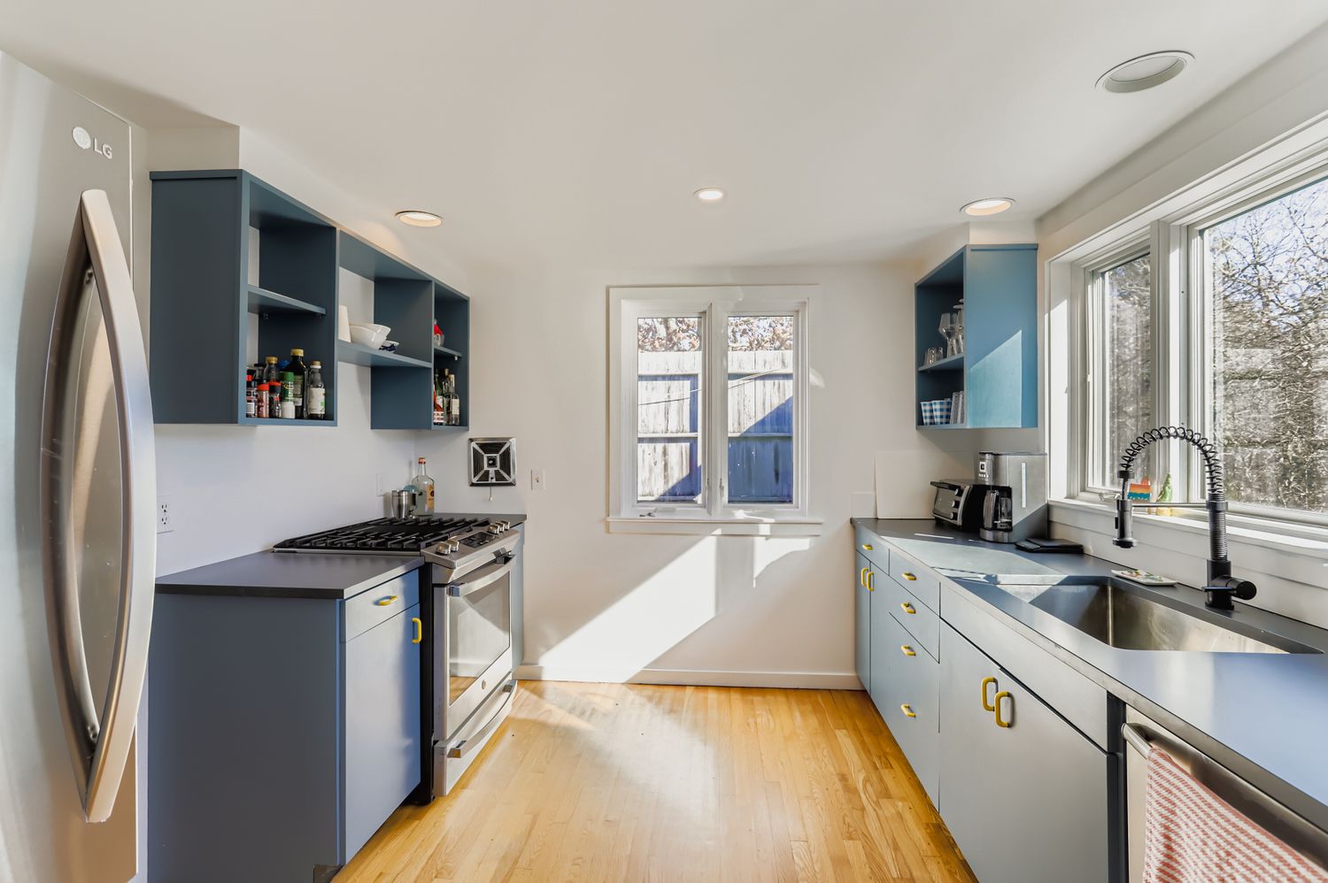 7 Black Point Road Chilmark, MA 02535 - Photo 23 of 47 a kitchen with stainless steel appliances granite countertop a sink stove and refrigerator