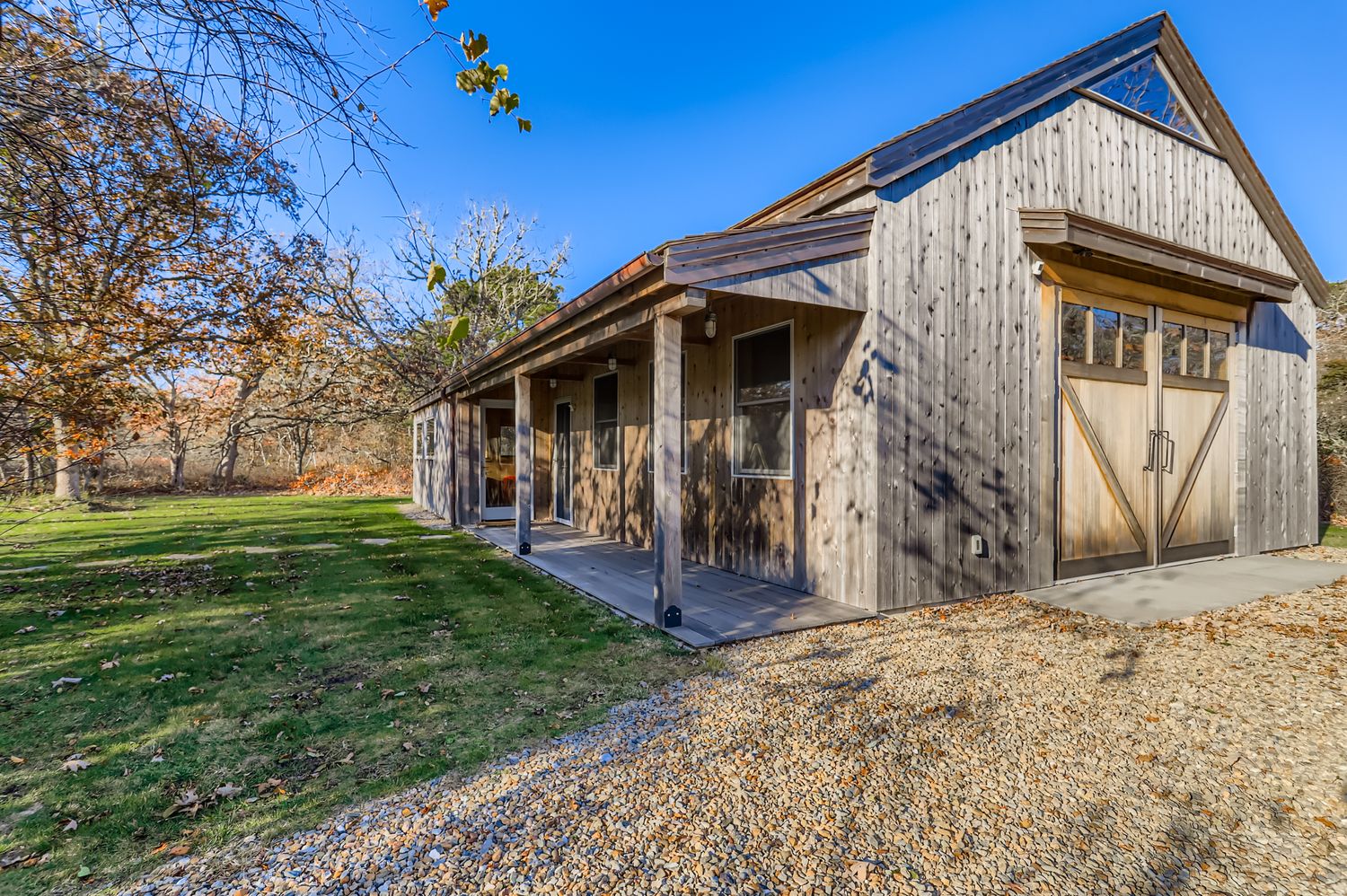 7 Black Point Road Chilmark, MA 02535 - Photo 31 of 47 a front view of a house with a yard