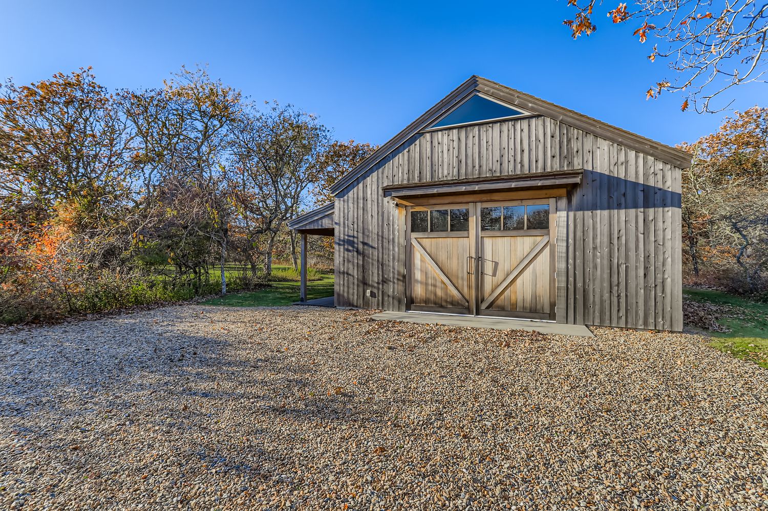 7 Black Point Road Chilmark, MA 02535 - Photo 33 of 47 a front view of a house with a yard