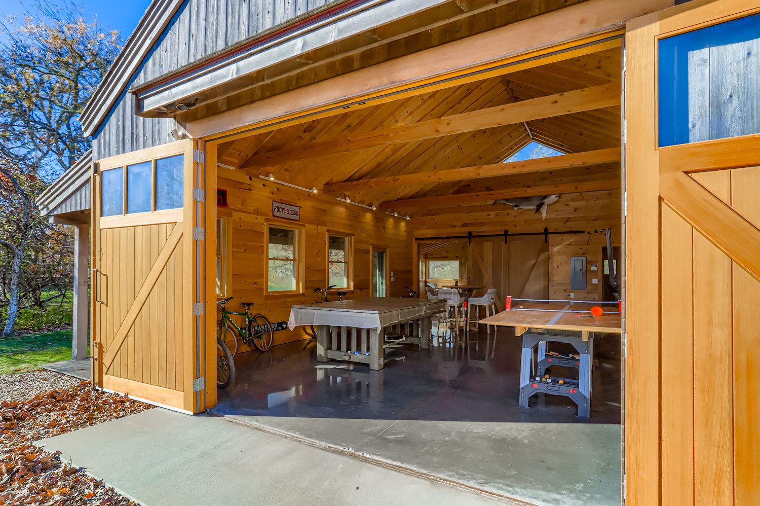 7 Black Point Road Chilmark, MA 02535 - Photo 35 of 47 a view of a patio with dining table and chairs