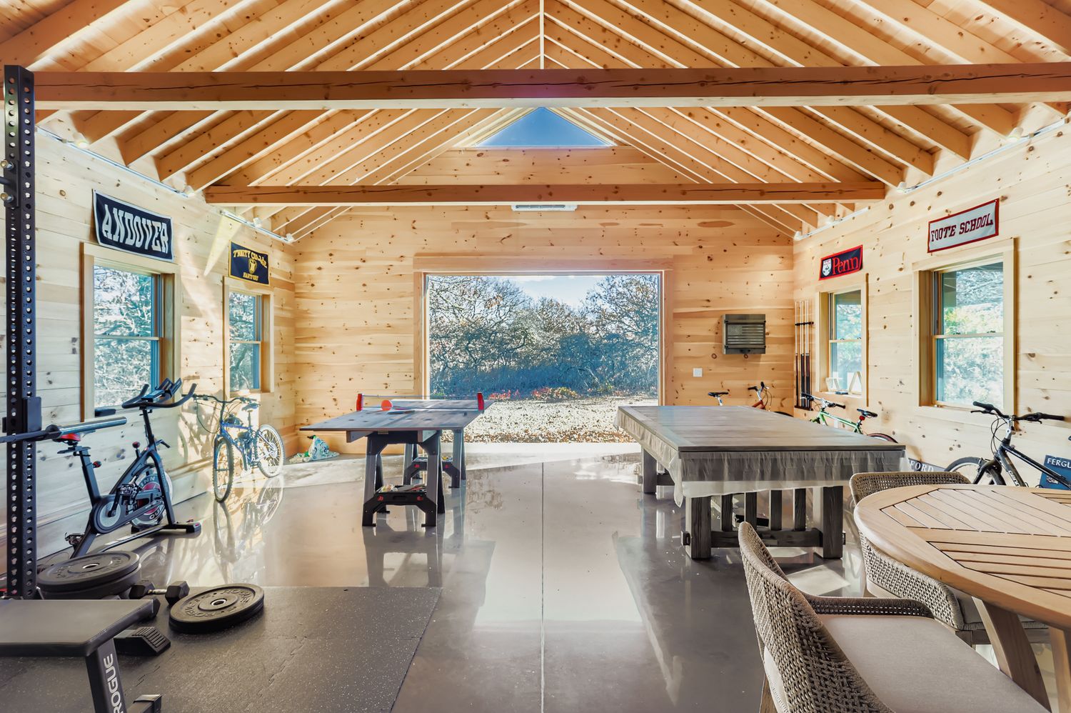 7 Black Point Road Chilmark, MA 02535 - Photo 40 of 47 a room with lots of tables a large window and chairs