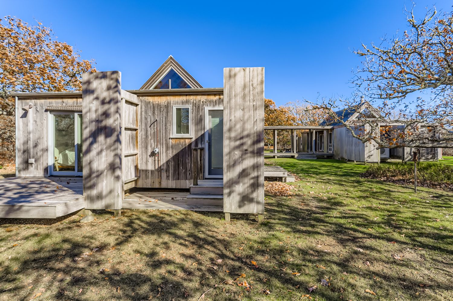 7 Black Point Road Chilmark, MA 02535 - Photo 5 of 47 a view of a house with a small yard and wooden fence