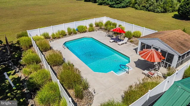 an aerial view of a house having a yard