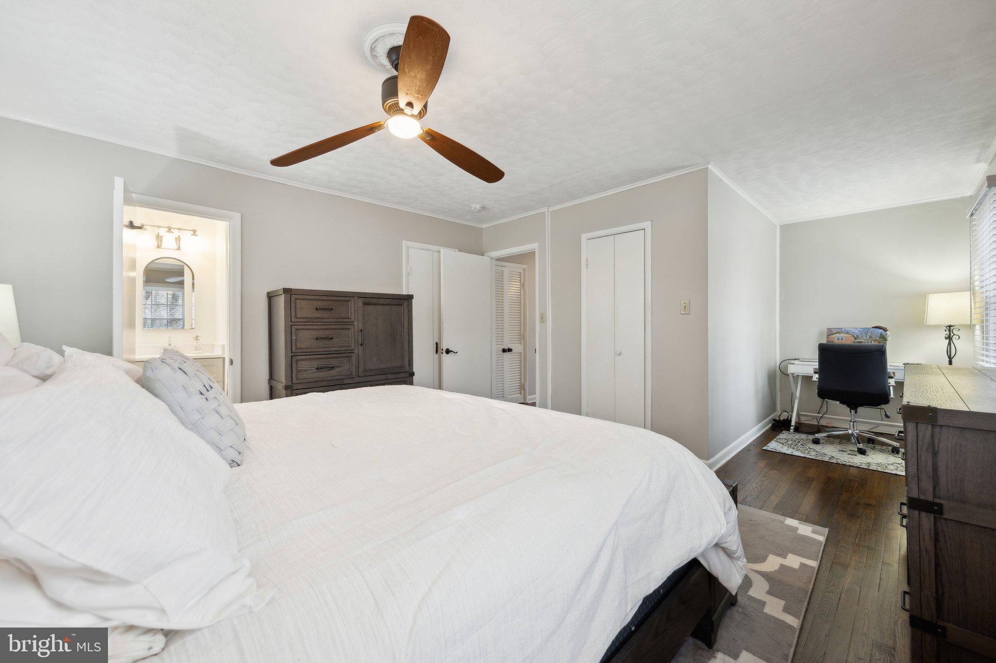 10601 Meadowhill Road Silver Spring, MD 20901 - Photo 12 of 33 a bedroom with a bed and wooden floor