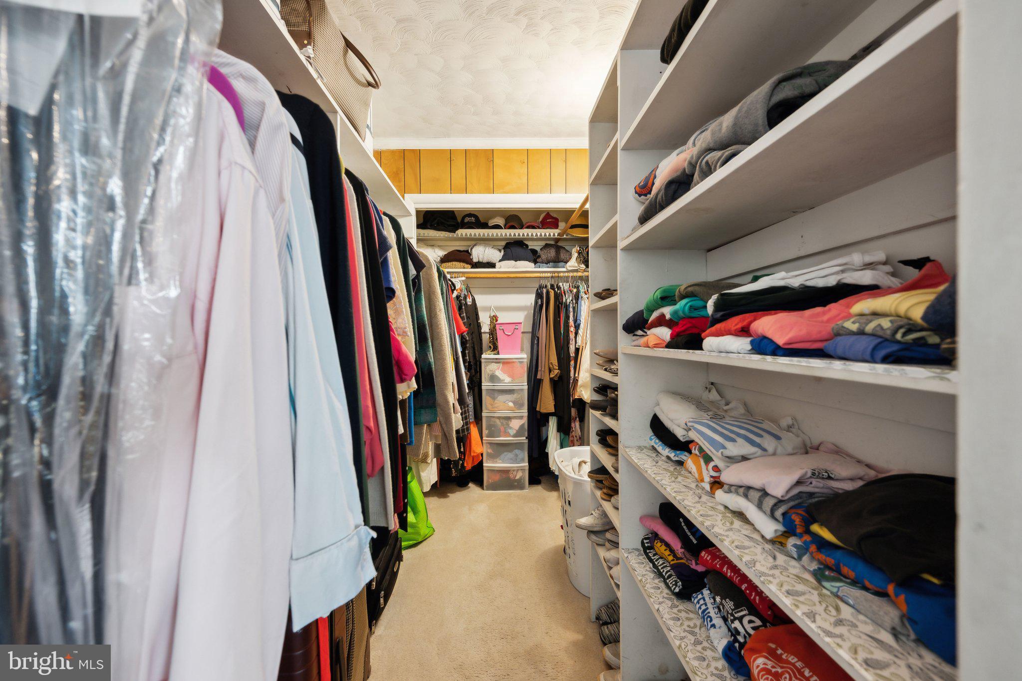 10601 Meadowhill Road Silver Spring, MD 20901 - Photo 14 of 33 a view of walk in closet with clothes and shoes
