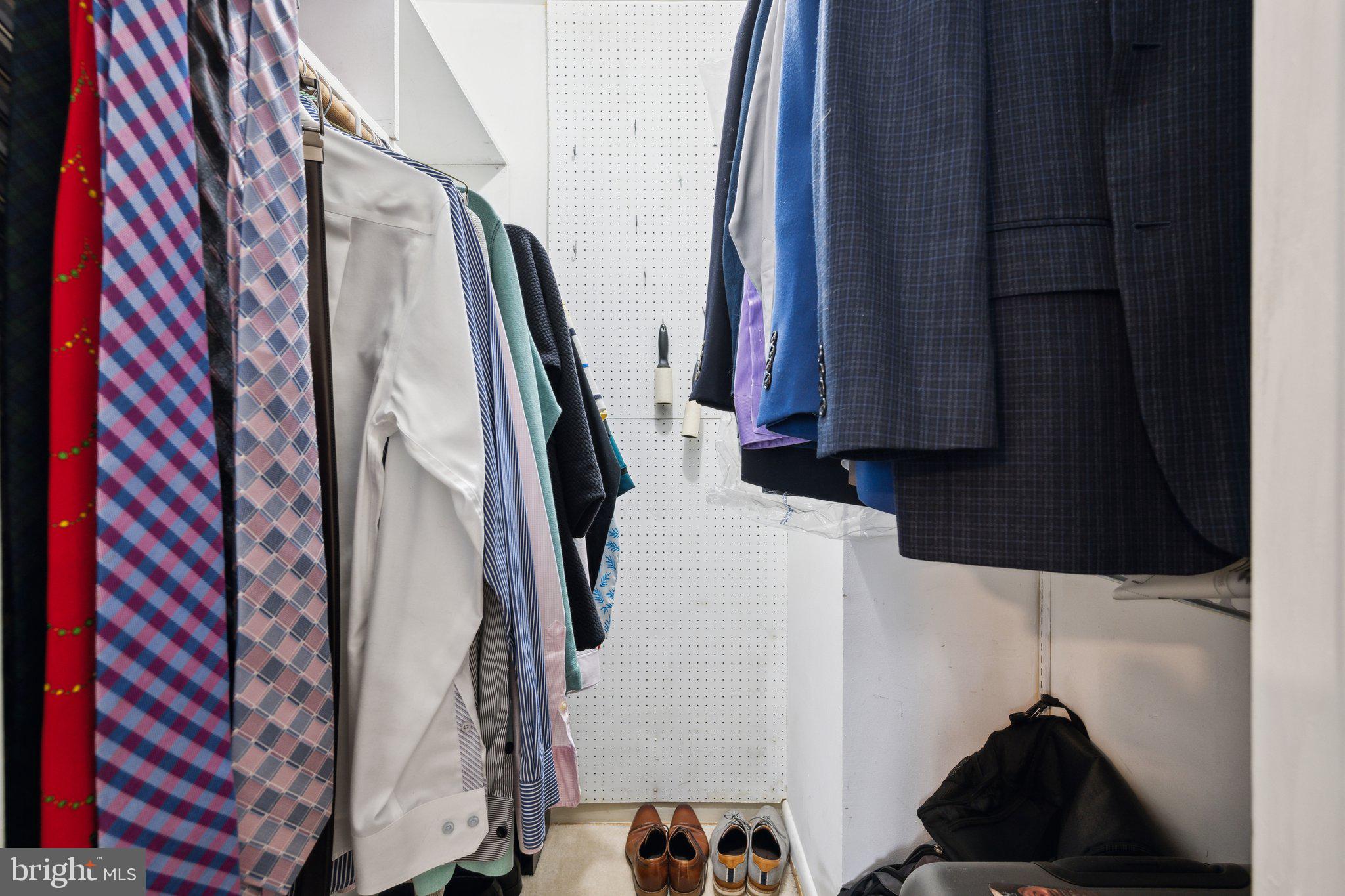 10601 Meadowhill Road Silver Spring, MD 20901 - Photo 15 of 33 a view of walk in closet with clothes and shoes