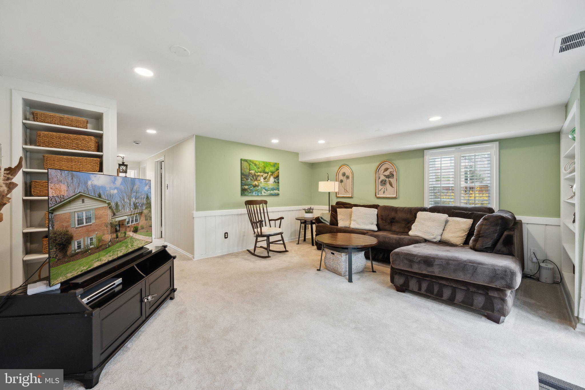10601 Meadowhill Road Silver Spring, MD 20901 - Photo 19 of 33 a living room with furniture and a flat screen tv