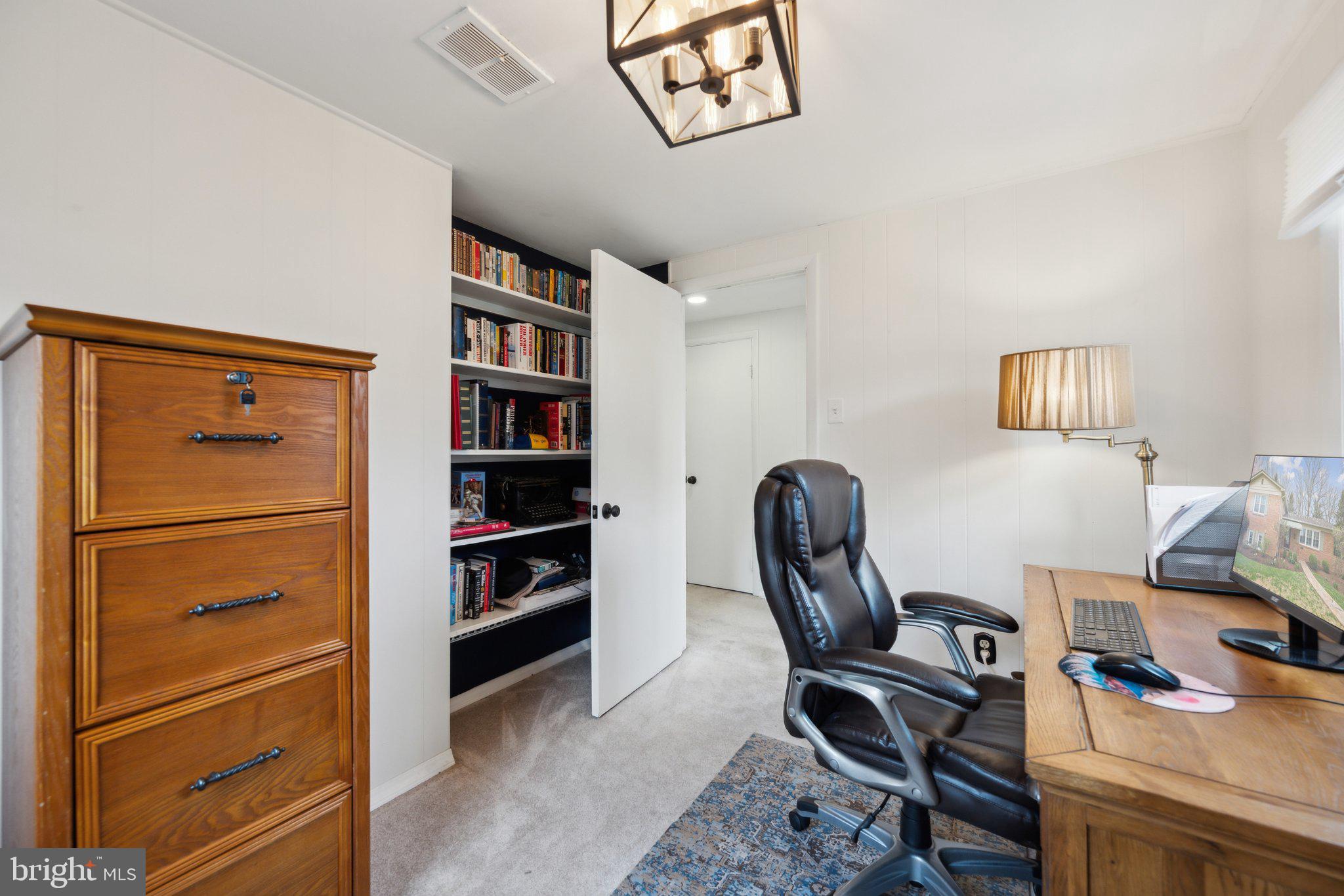 10601 Meadowhill Road Silver Spring, MD 20901 - Photo 24 of 33 a view of a workspace with furniture and a window