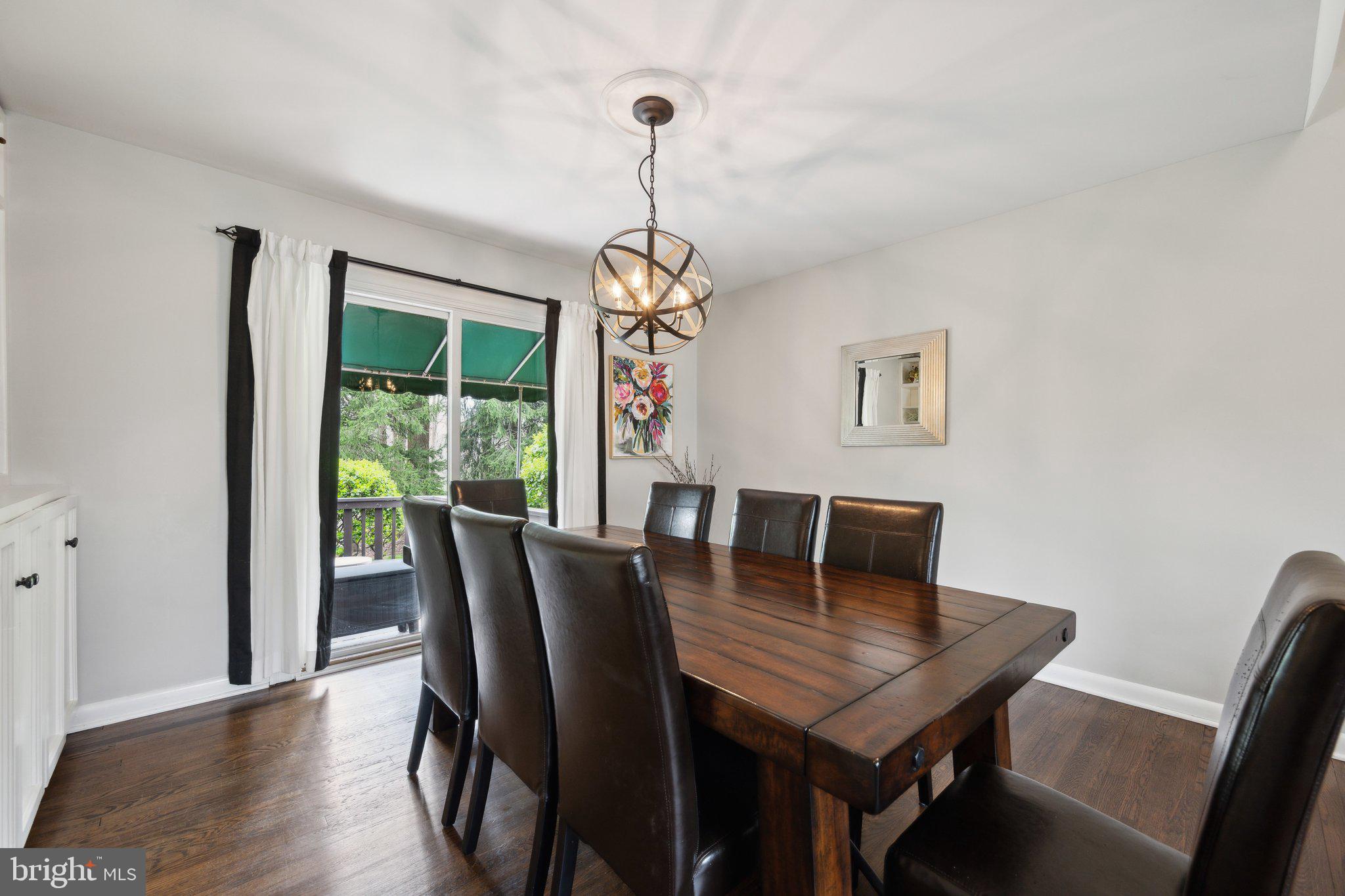 10601 Meadowhill Road Silver Spring, MD 20901 - Photo 5 of 33 a view of a dining room with furniture window and wooden floor