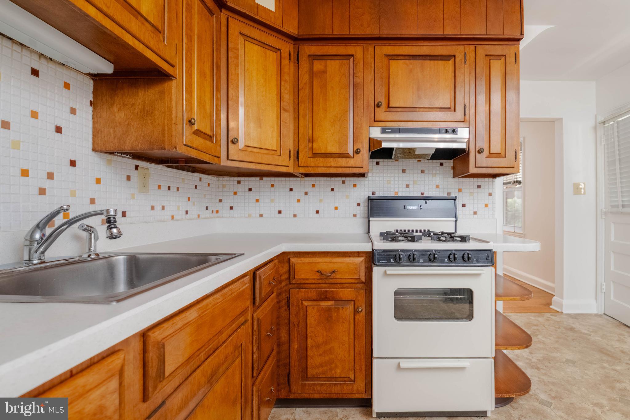 1102 Orems Road Baltimore, MD 21220 - Photo 11 of 46 a kitchen with stainless steel appliances granite countertop a sink a stove and cabinets