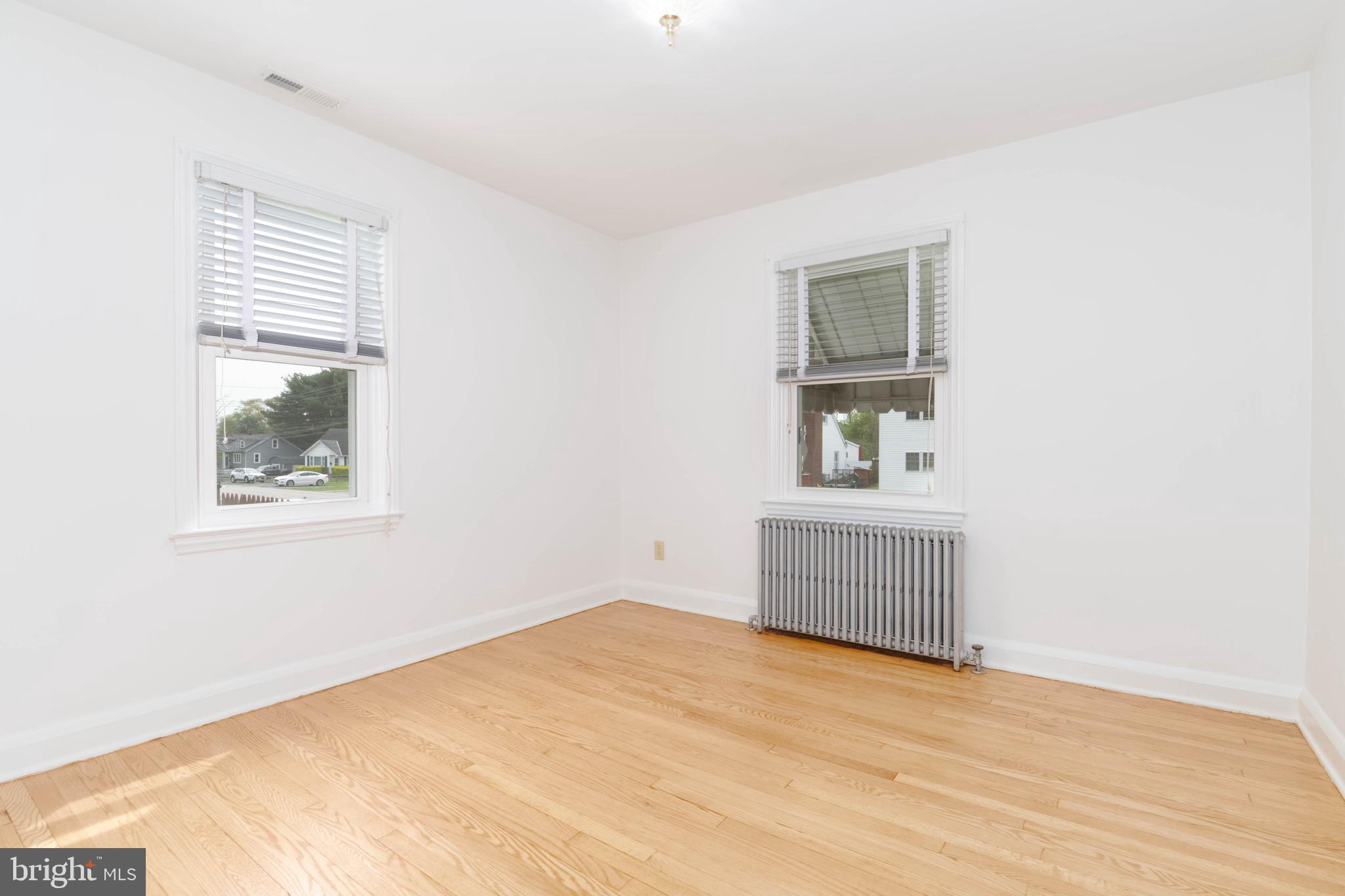 1102 Orems Road Baltimore, MD 21220 - Photo 12 of 46 a room with a window and wooden floor