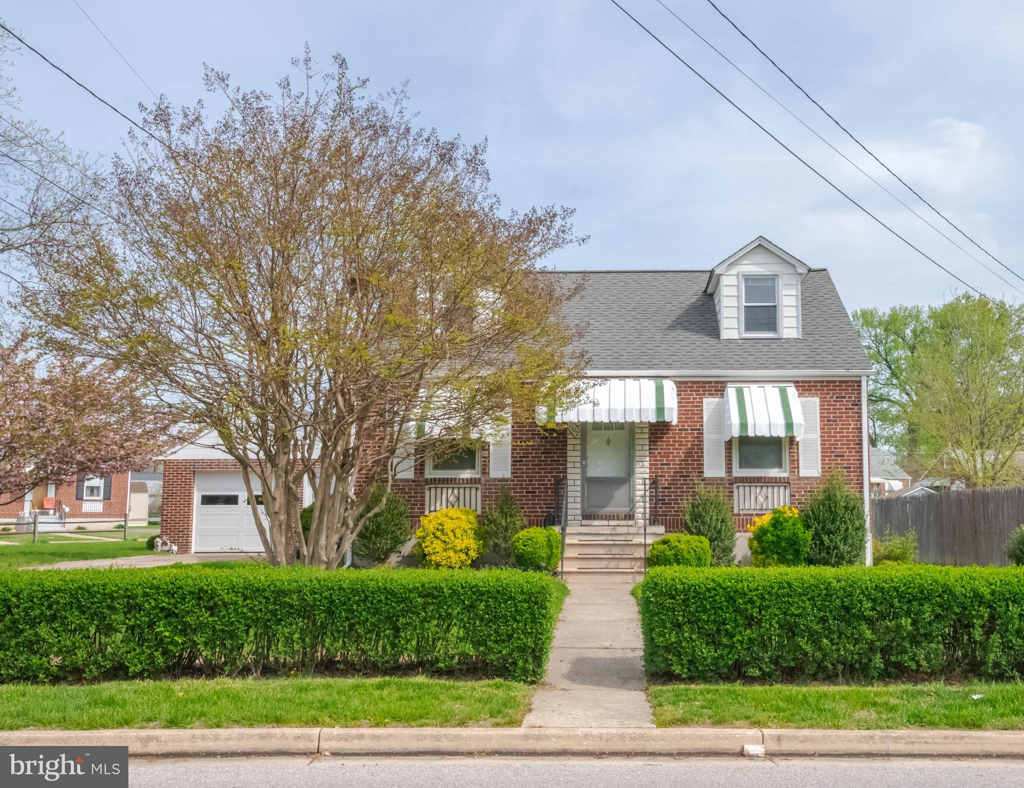 1102 Orems Road Baltimore, MD 21220 - Photo 2 of 46 a front view of a house with a yard