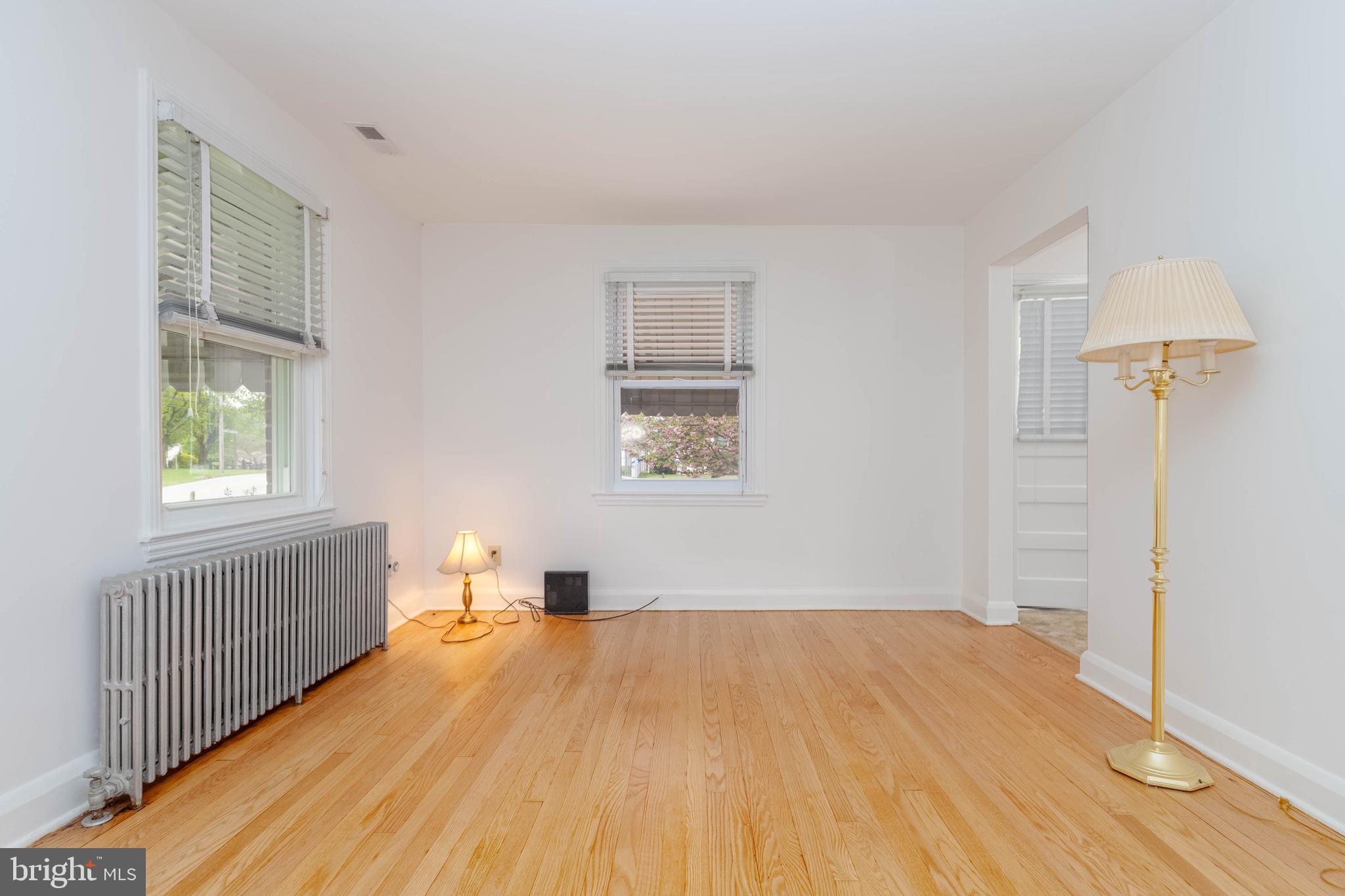 1102 Orems Road Baltimore, MD 21220 - Photo 22 of 46 a bedroom with a bed and wooden floor