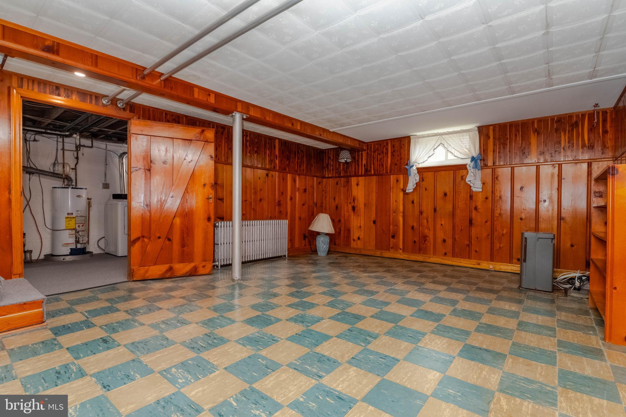 1102 Orems Road Baltimore, MD 21220 - Photo 32 of 46 a view of an empty room with wooden walls