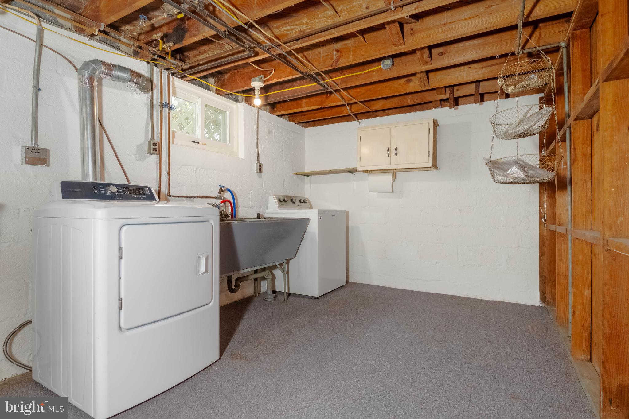 1102 Orems Road Baltimore, MD 21220 - Photo 36 of 46 a view of a storage & utility room with a sink