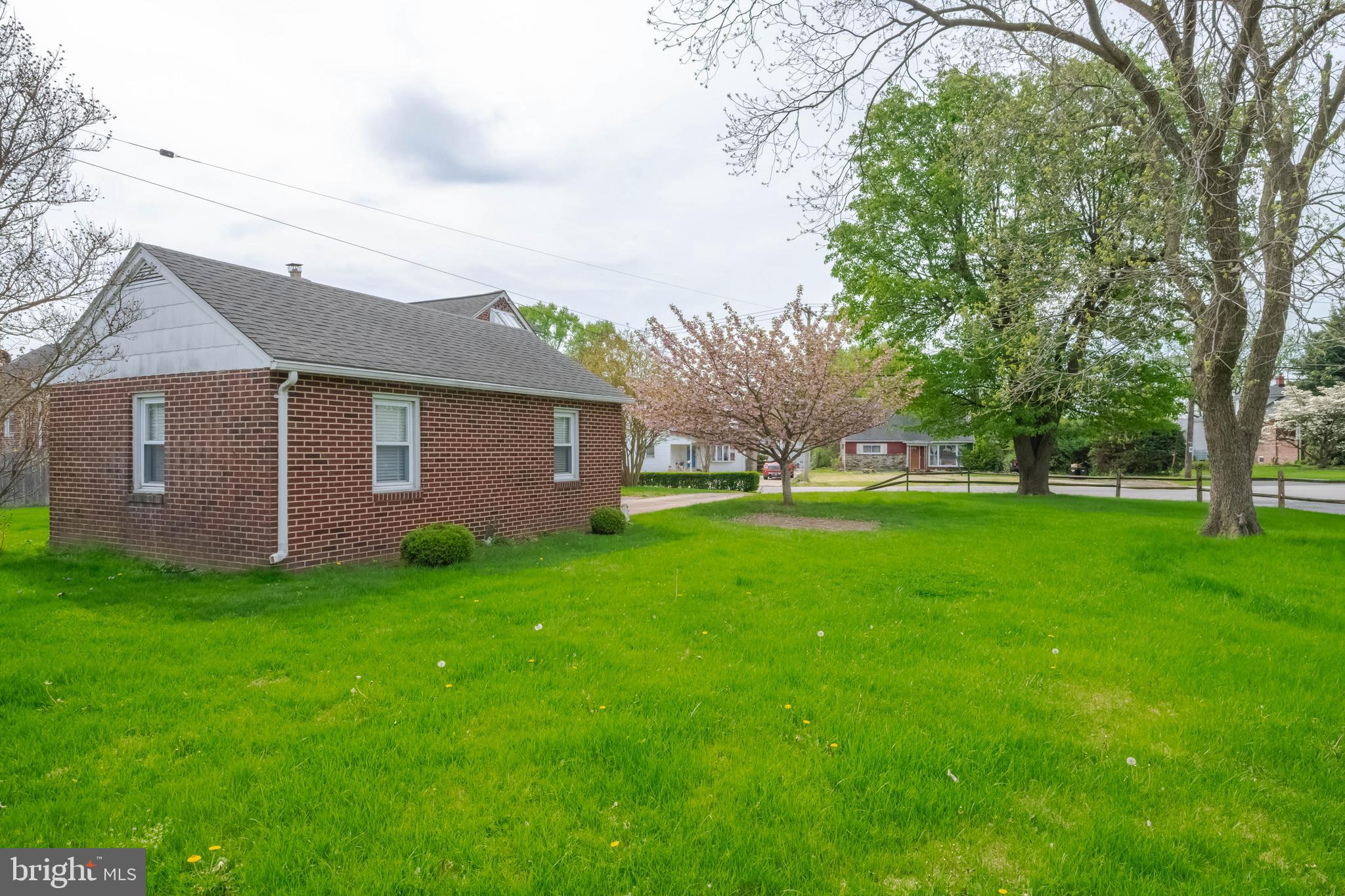 1102 Orems Road Baltimore, MD 21220 - Photo 43 of 46 a view of a yard in front of a house with large tree