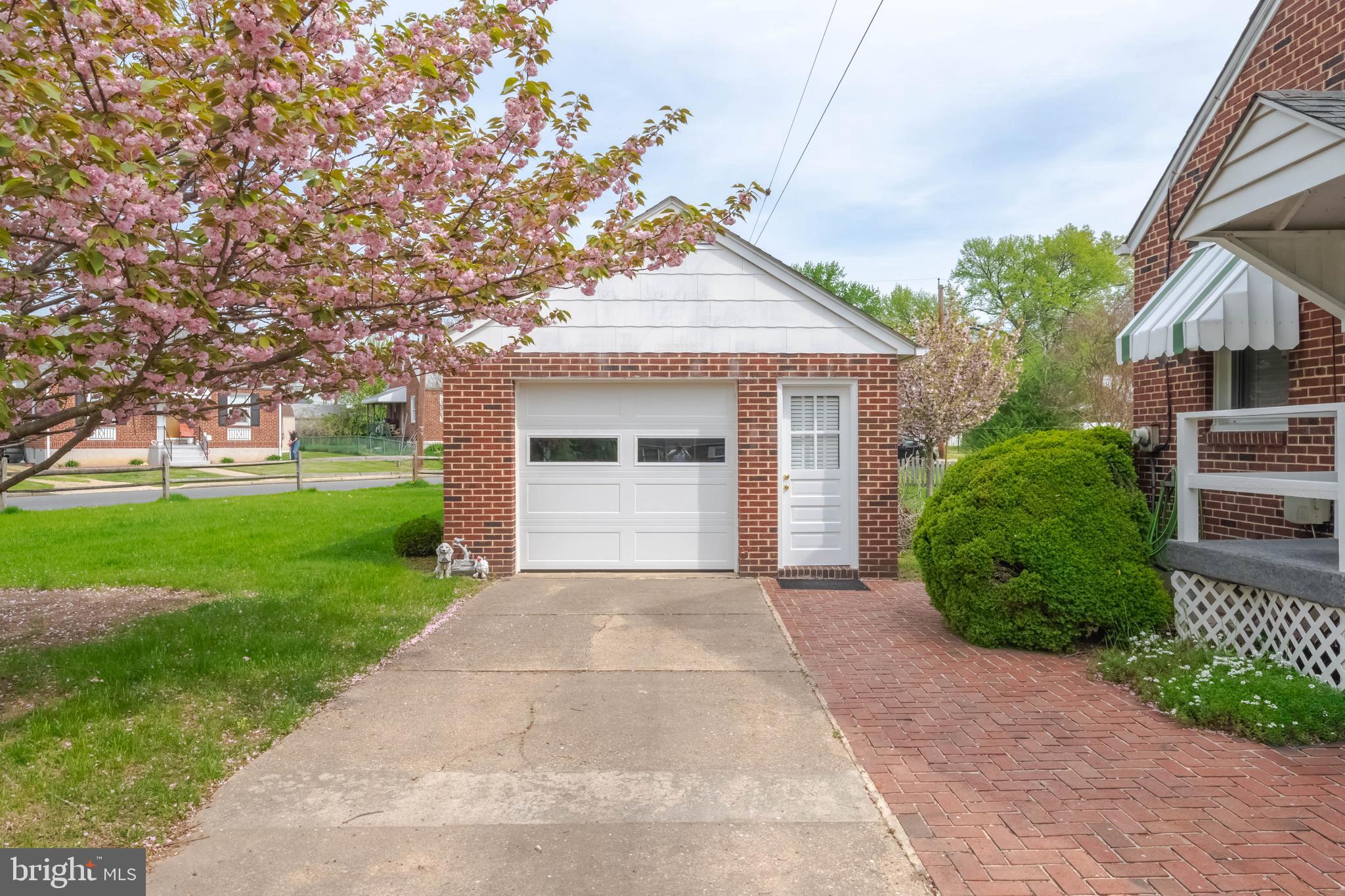 1102 Orems Road Baltimore, MD 21220 - Photo 46 of 46 a front view of a house with a yard and garage