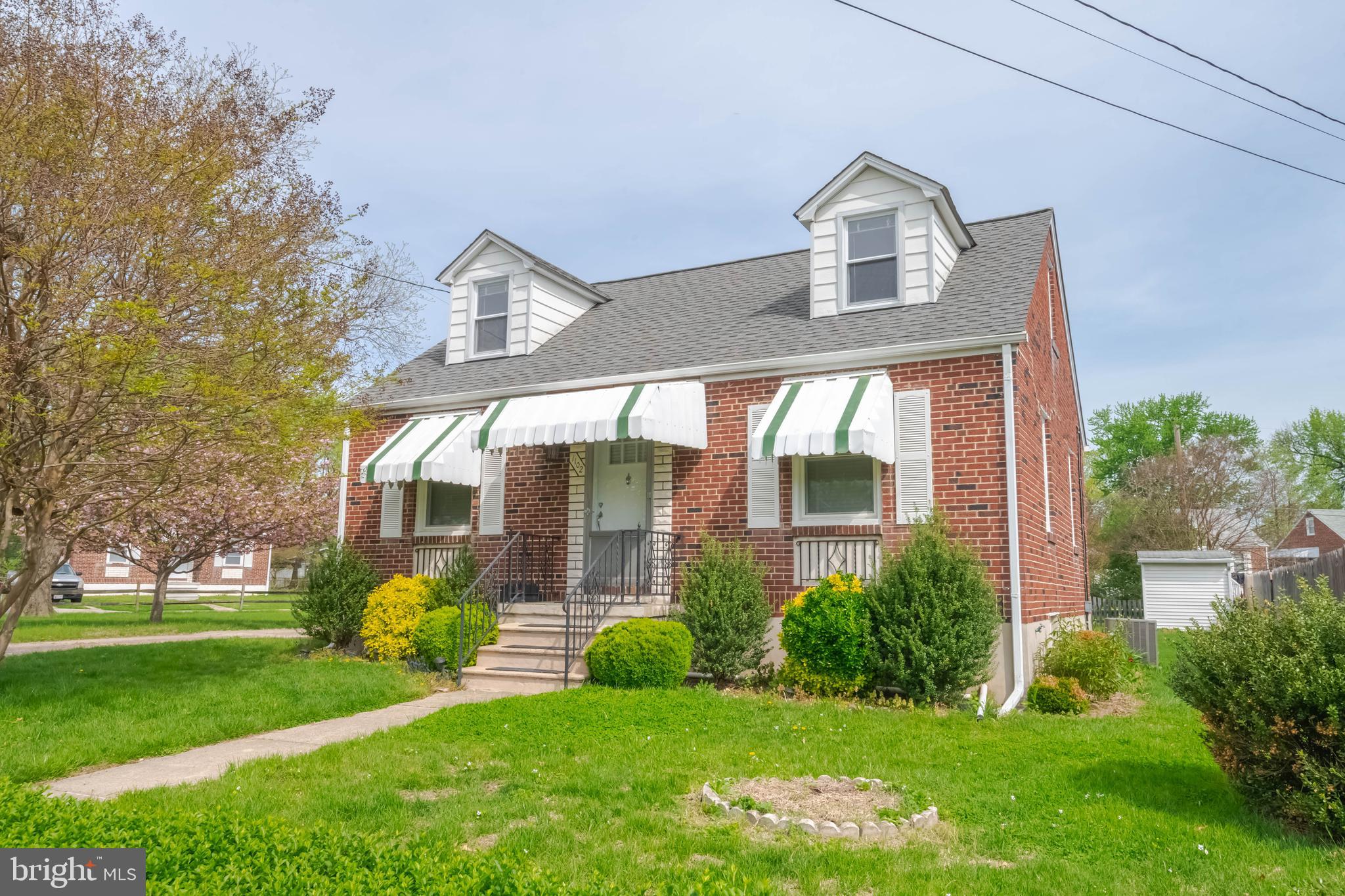 1102 Orems Road Baltimore, MD 21220 - Photo 6 of 46 a front view of a house with a yard