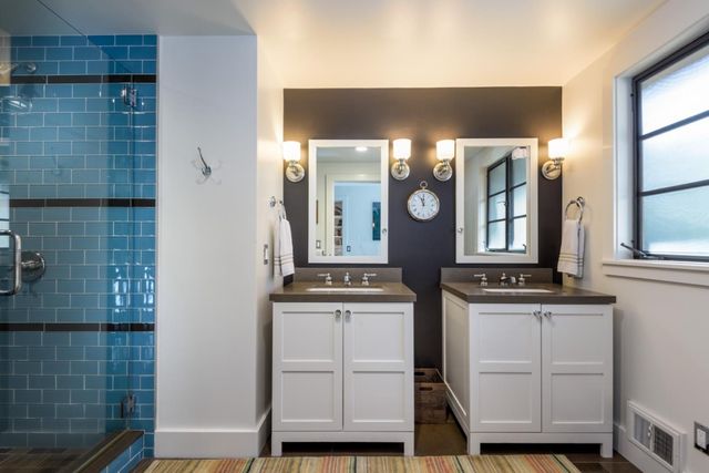 a kitchen with cabinets and window