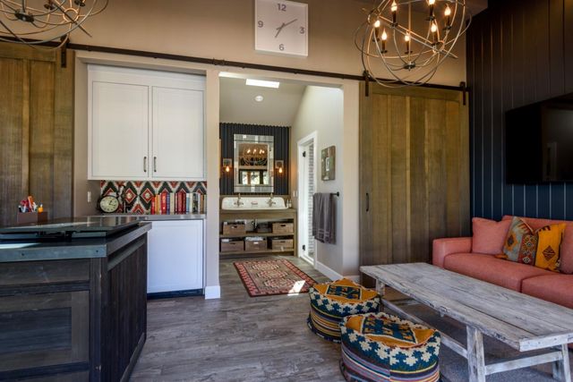 a bedroom with furniture and a flat screen tv