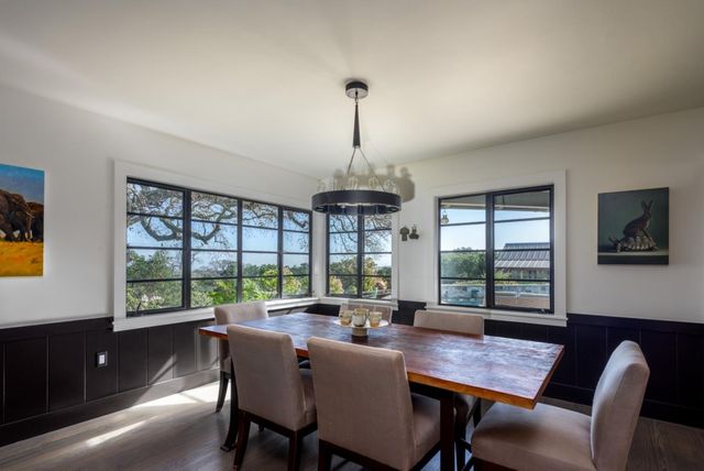 a view of a dining room with furniture window and outside view