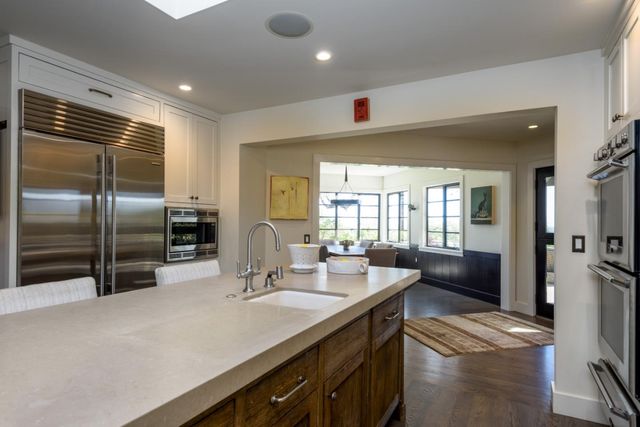 a kitchen with counter top space cabinets and stainless steel appliances
