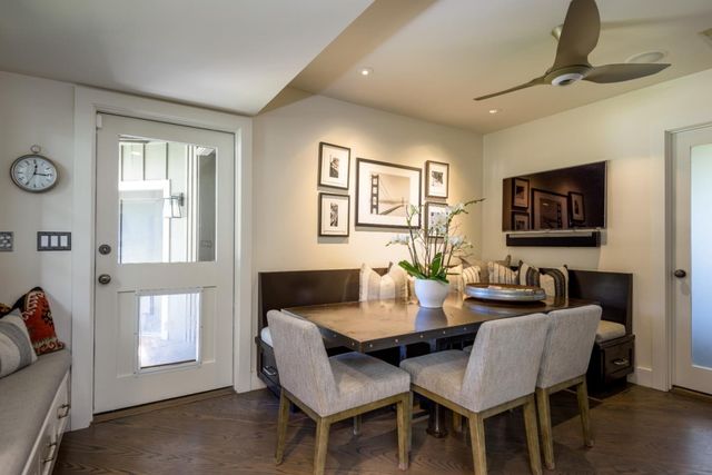 a view of a dining room with furniture and a window