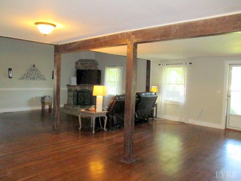 4740 Payneton Road Chatham, VA 24531 - Photo 18 of 49 a view of a dining room with furniture and wooden floor