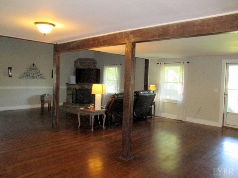 4740 Payneton Road Chatham, VA 24531 - Photo 19 of 49 a view of a dining room with furniture and wooden floor