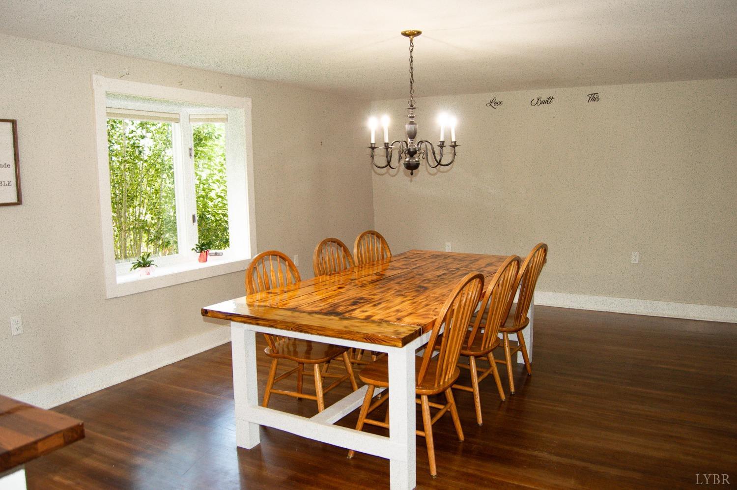 4740 Payneton Road Chatham, VA 24531 - Photo 24 of 49 a view of a dining room with furniture wooden floor and chandelier