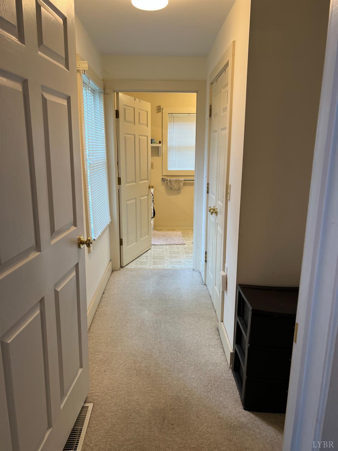 4740 Payneton Road Chatham, VA 24531 - Photo 29 of 49 a view of a hallway with wooden floor and cabinet