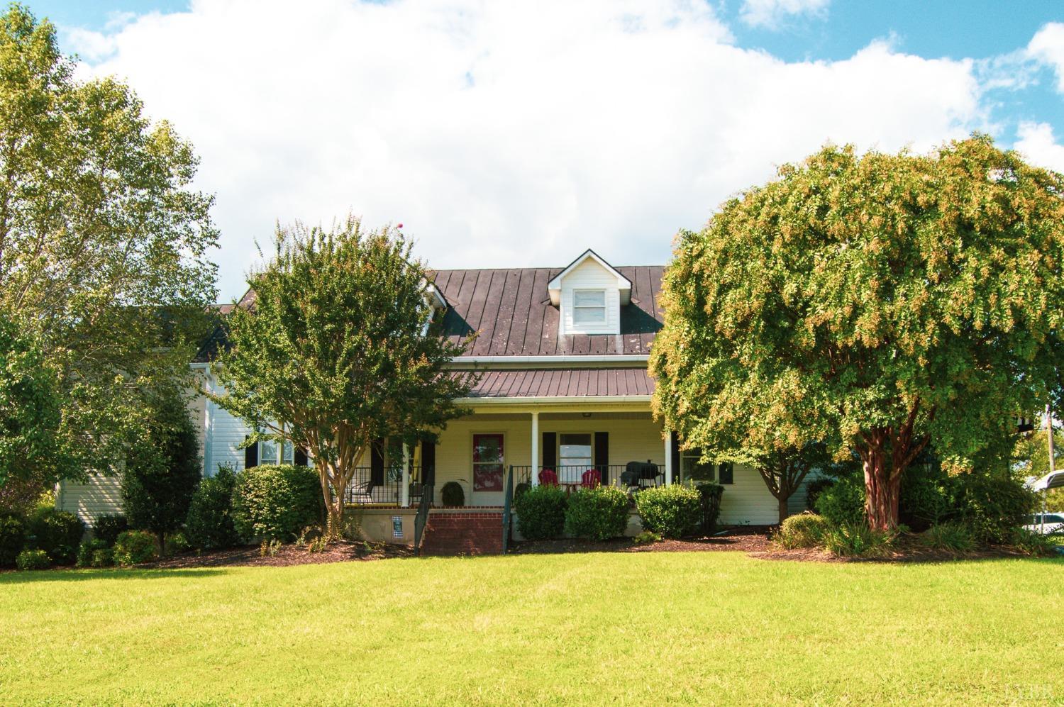 4740 Payneton Road Chatham, VA 24531 - Photo 3 of 49 a front view of a building with a garden