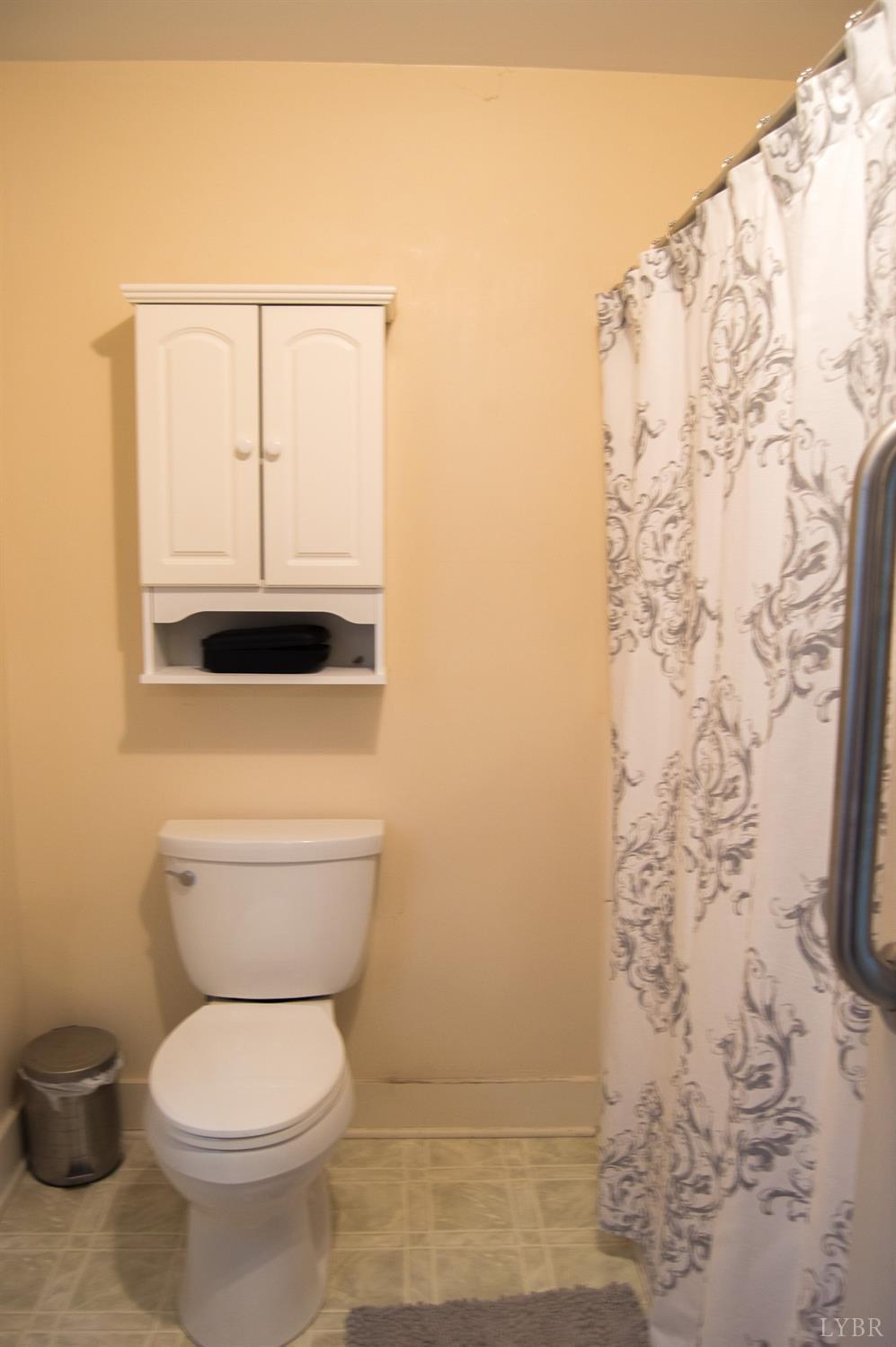 4740 Payneton Road Chatham, VA 24531 - Photo 32 of 49 a bathroom with a toilet and a shower curtain