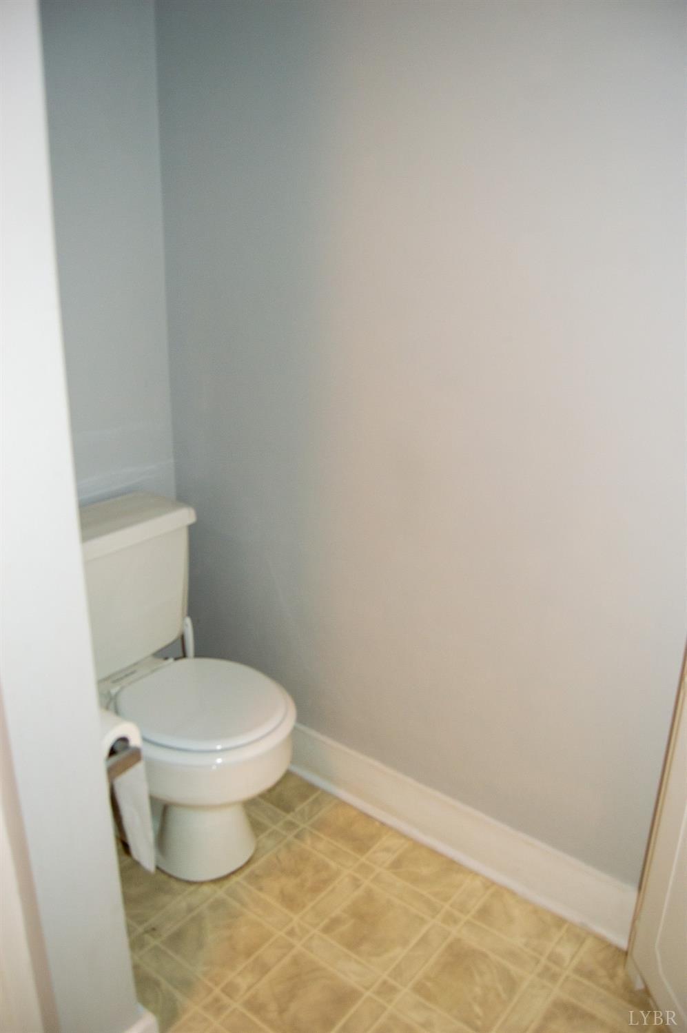 4740 Payneton Road Chatham, VA 24531 - Photo 42 of 49 a white toilet sitting next to a white cabinet