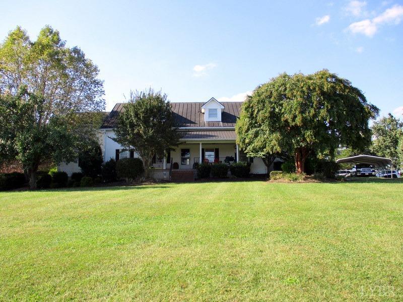 4740 Payneton Road Chatham, VA 24531 - Photo 49 of 49 a front view of a house with a yard and garage
