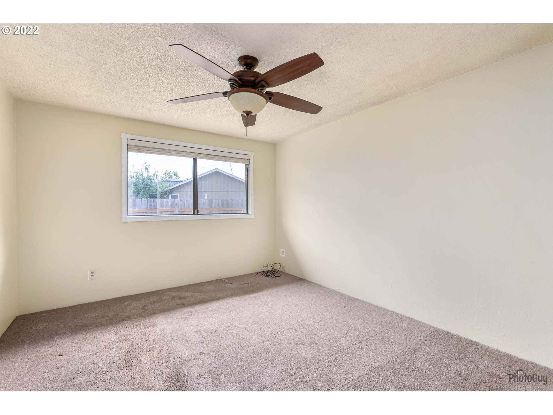 529 Sandstone Way Eugene, OR 97402 - Photo 12 of 19 a view of an empty room with a window