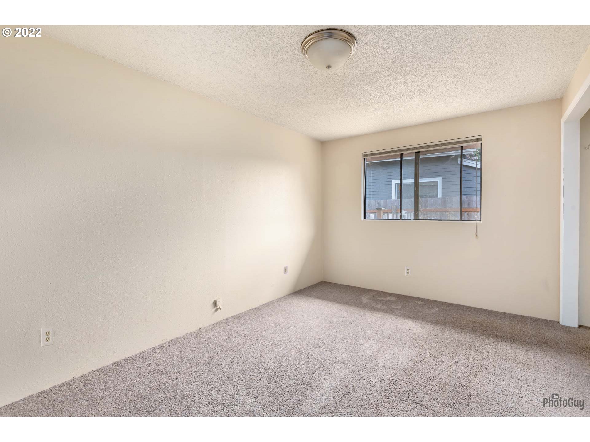 529 Sandstone Way Eugene, OR 97402 - Photo 15 of 19 a view of an empty room with a window