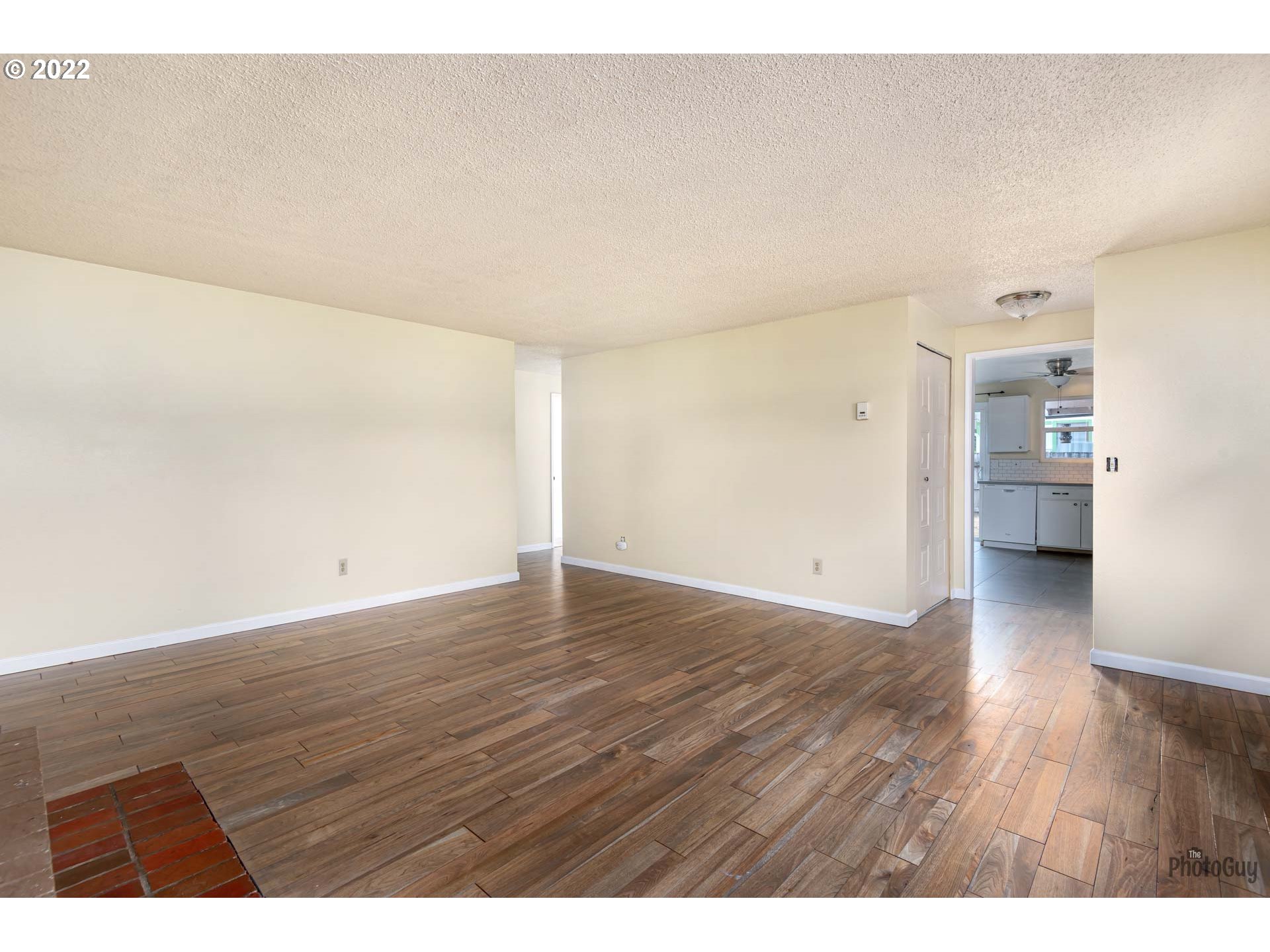 529 Sandstone Way Eugene, OR 97402 - Photo 7 of 19 a view of an empty room and wooden floor