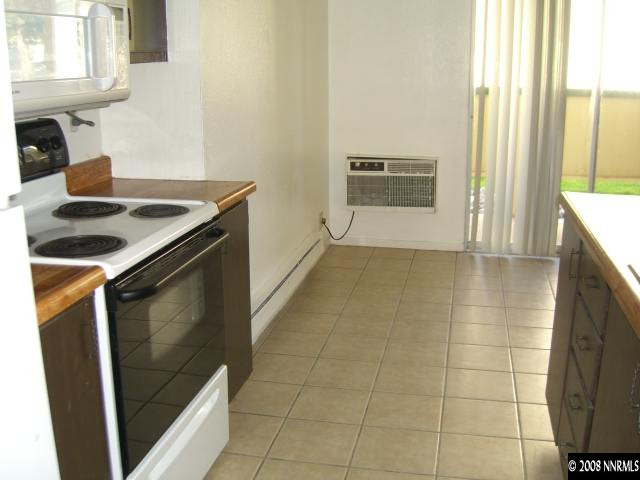 3922 Clear Acre Lane Reno, NV 89512 - Photo 3 of 3 a kitchen with a sink and a stove top oven