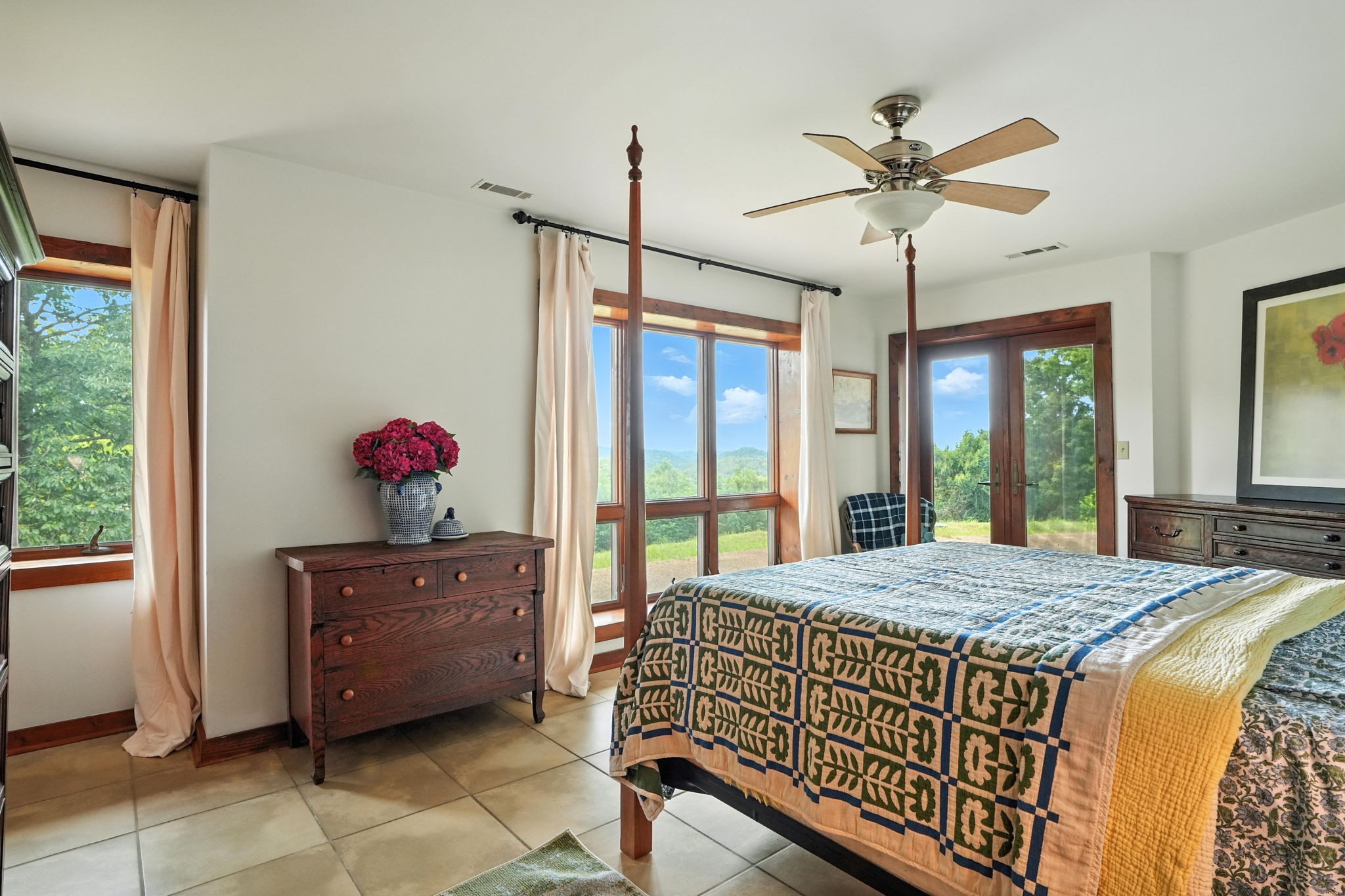 4445 Hurricane Ridge Road Smithville, TN 37166 - Photo 47 of 84 a bedroom with a bed and a chandelier